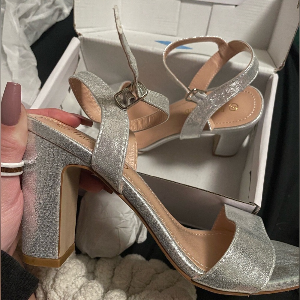 brand new never worn silver open toe heels. womens US size 8. Perfect condition.